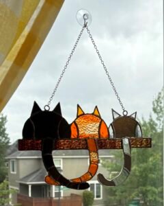 A birthday gift for a friend with three cats of similar shades.